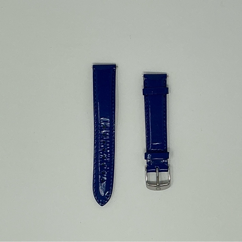 18mm bright blue patent leather w silver buckle.  Bag included.